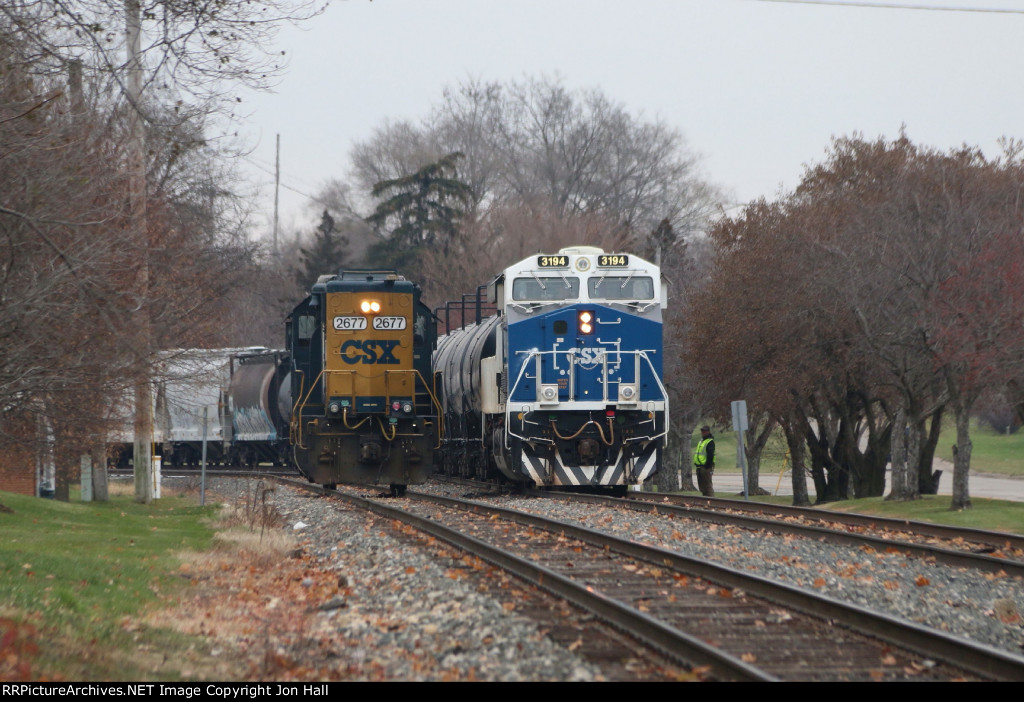 Y121's conductor stand s on the south side as he does a roll-by for Q326